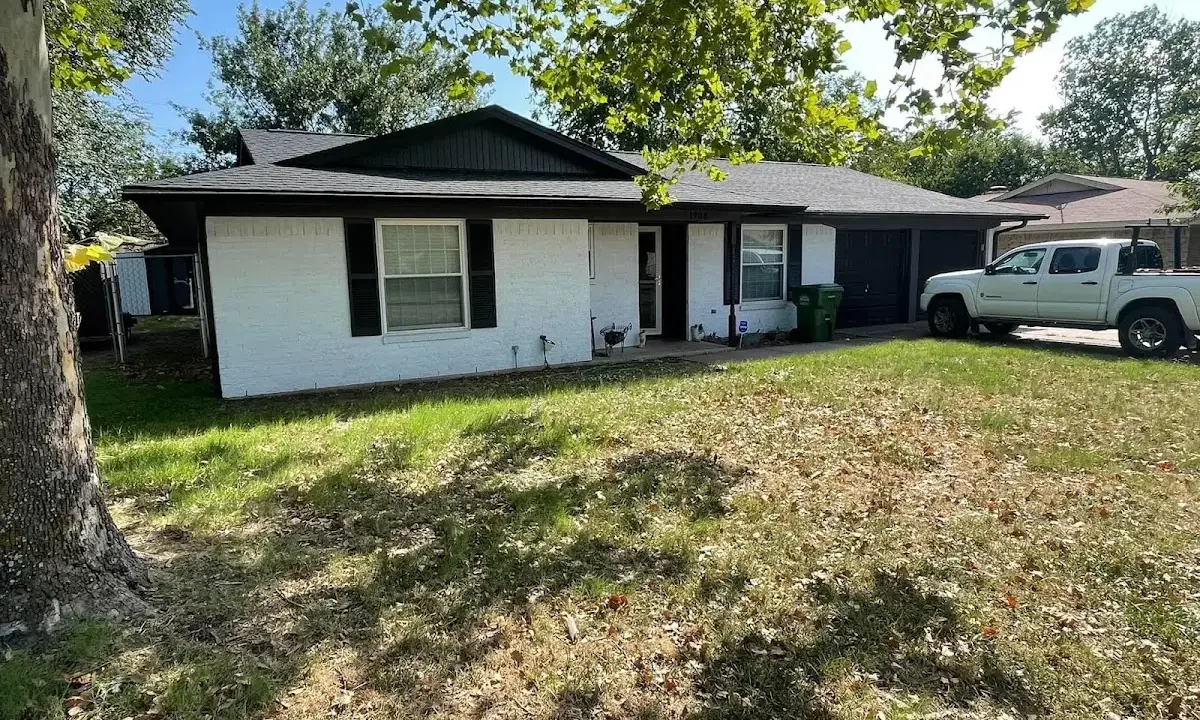 Professional roofing crew working on a residential roof in Alafaya